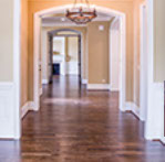 image of a hallway with a new laminated wooden floor